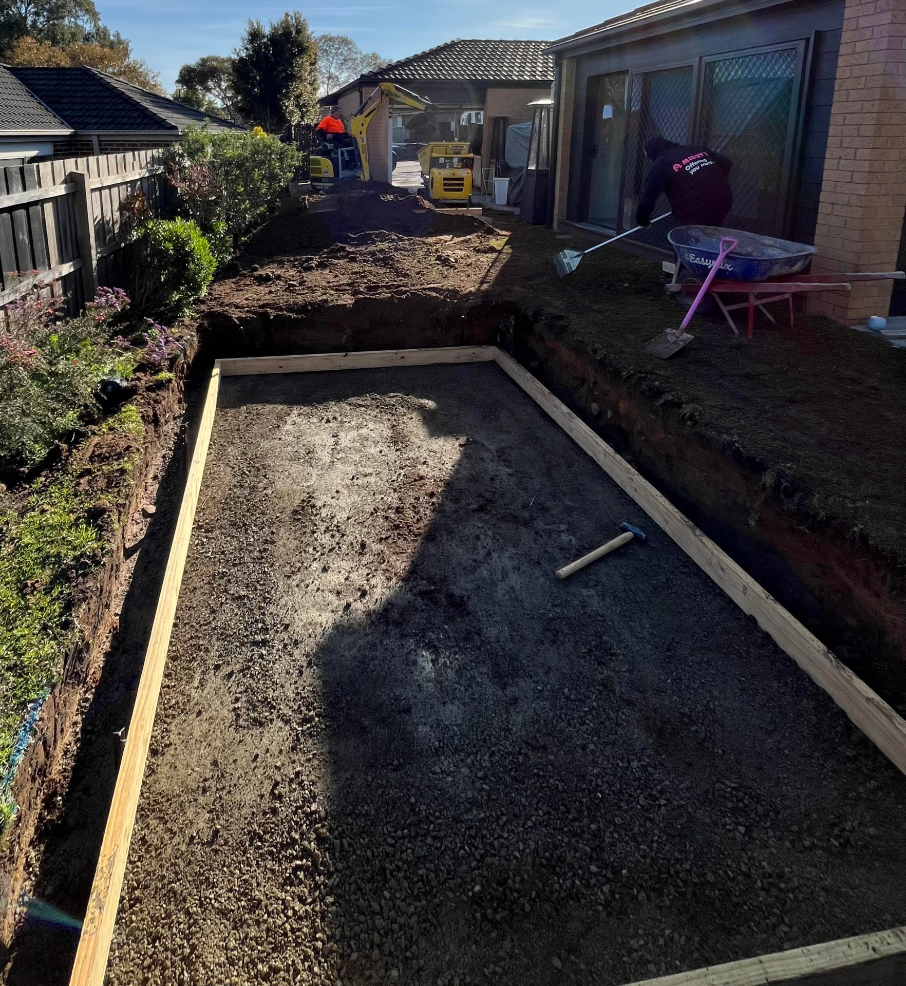 Spa base formwork and subgrade prep — Timber formwork set to level over a compacted crushed rock subgrade, ready for a spa installation
