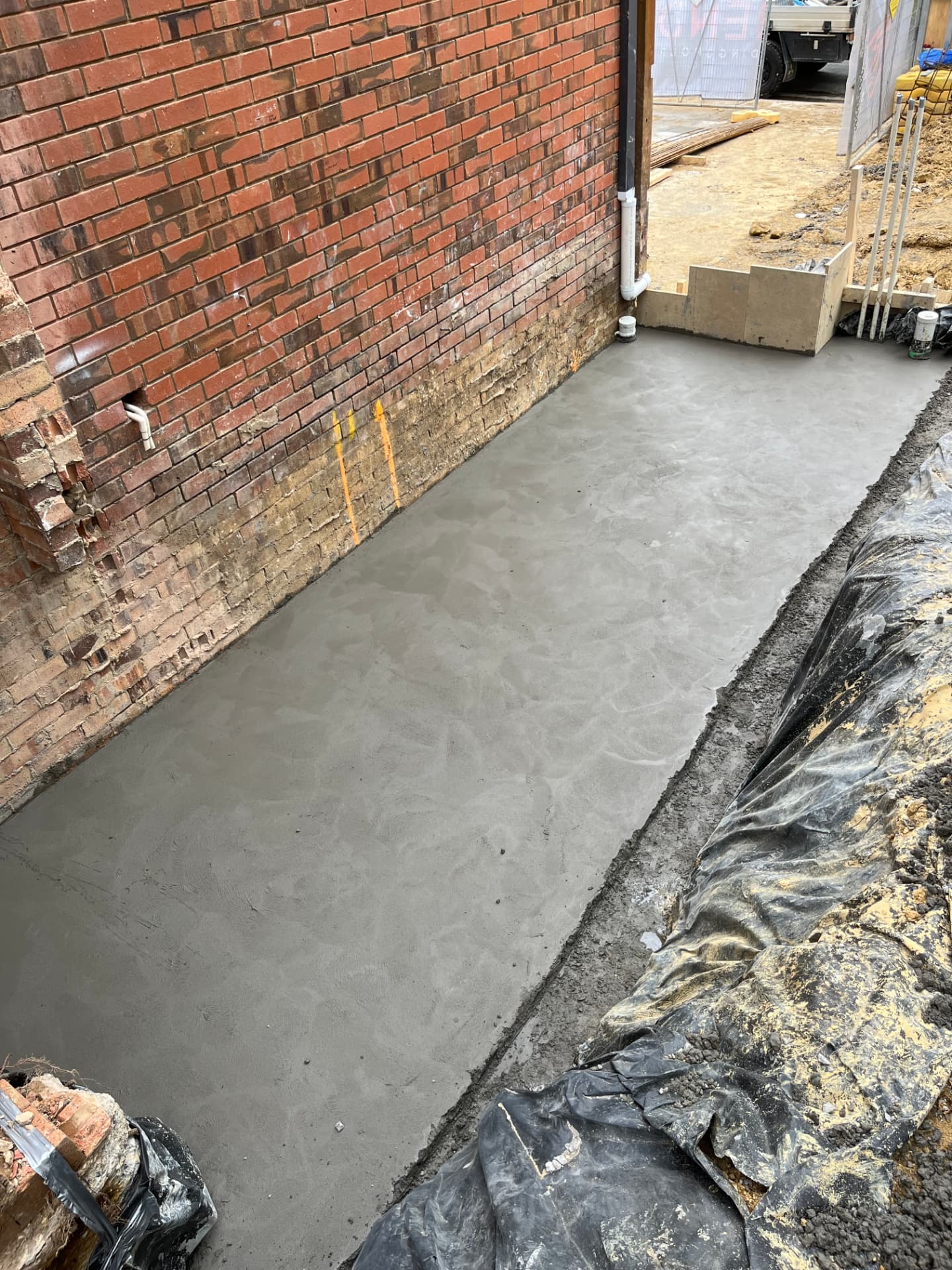Structural slab tied into existing construction