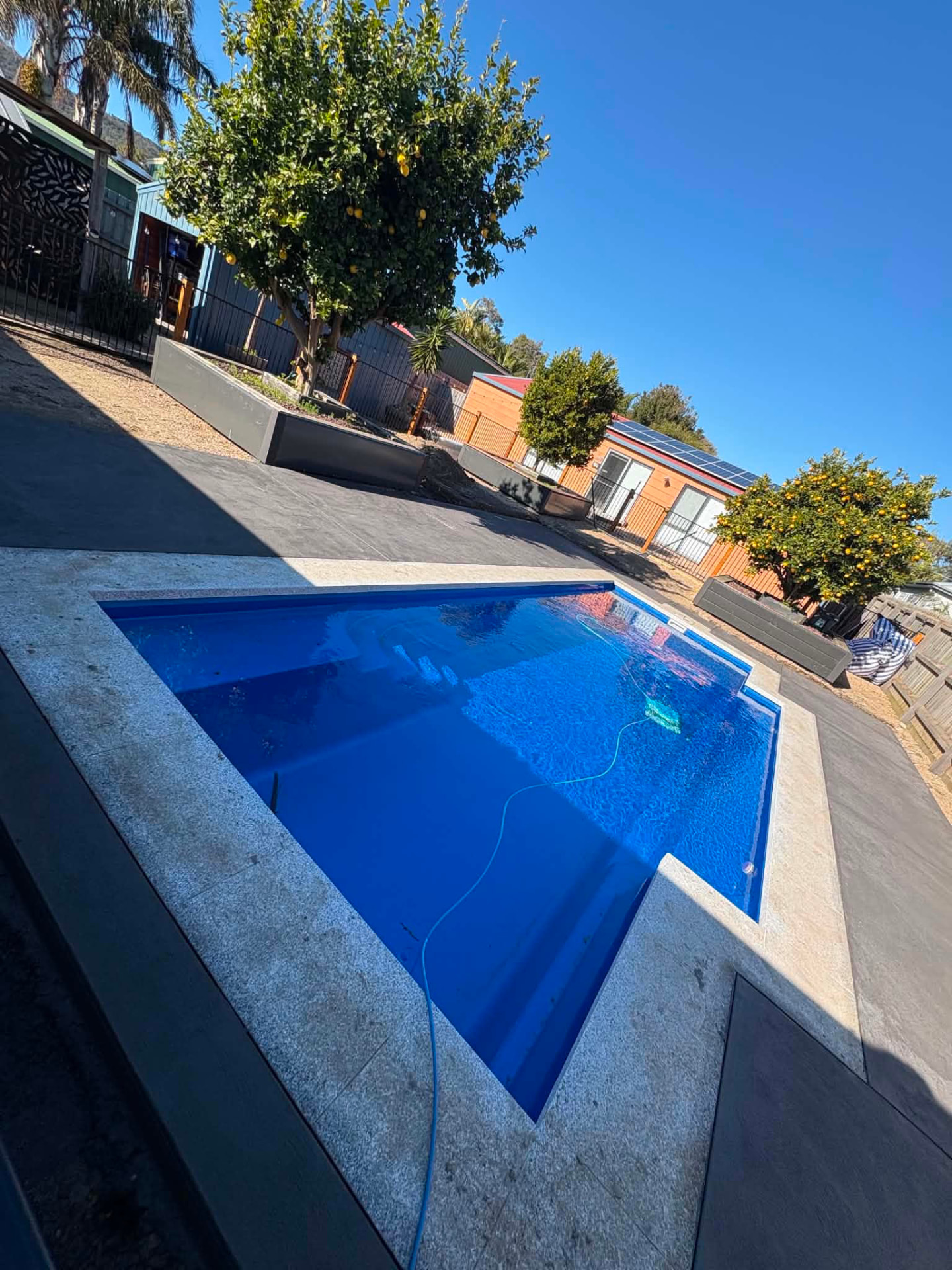 Pool surround with granite coping