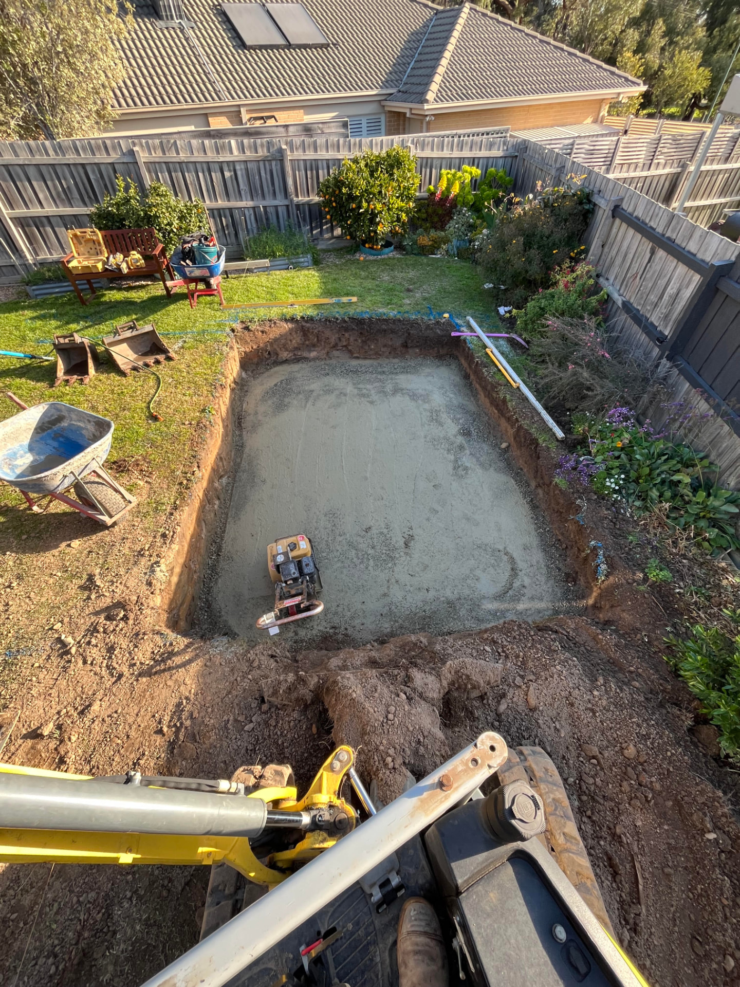 Pool excavation and base prep — Backyard pool dig, compacted base and tight-access spoil removal