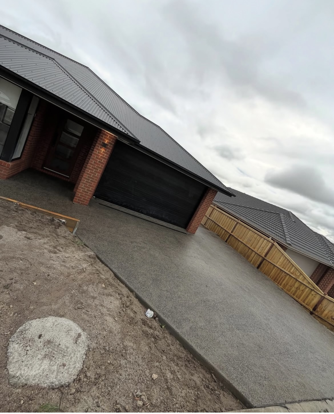 Exposed aggregate driveway — new home