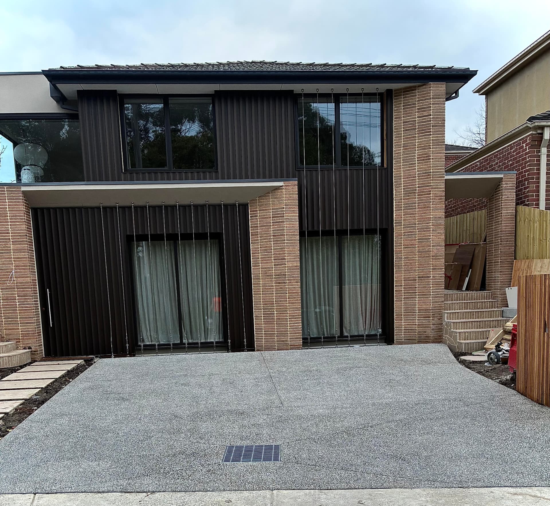 Exposed aggregate driveway with integrated stormwater grate